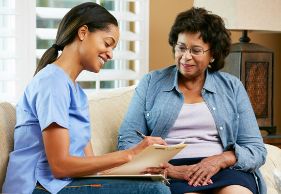 Nurse Making Notes During Home Visit With Senior Female Patient You don’t have to wait. You don’t have to do this alone.